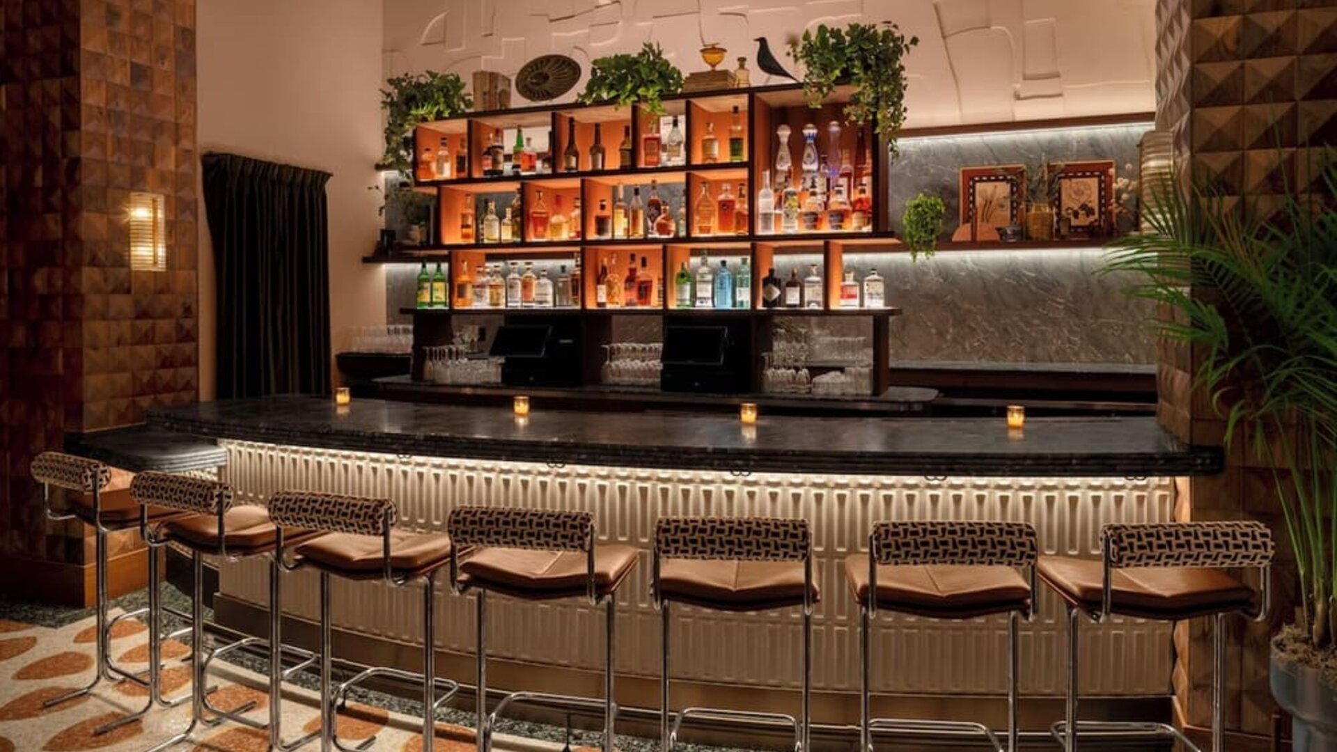 Stylish cocktail bar with ambient lighting and upscale seating at Hyatt Union Square New York.