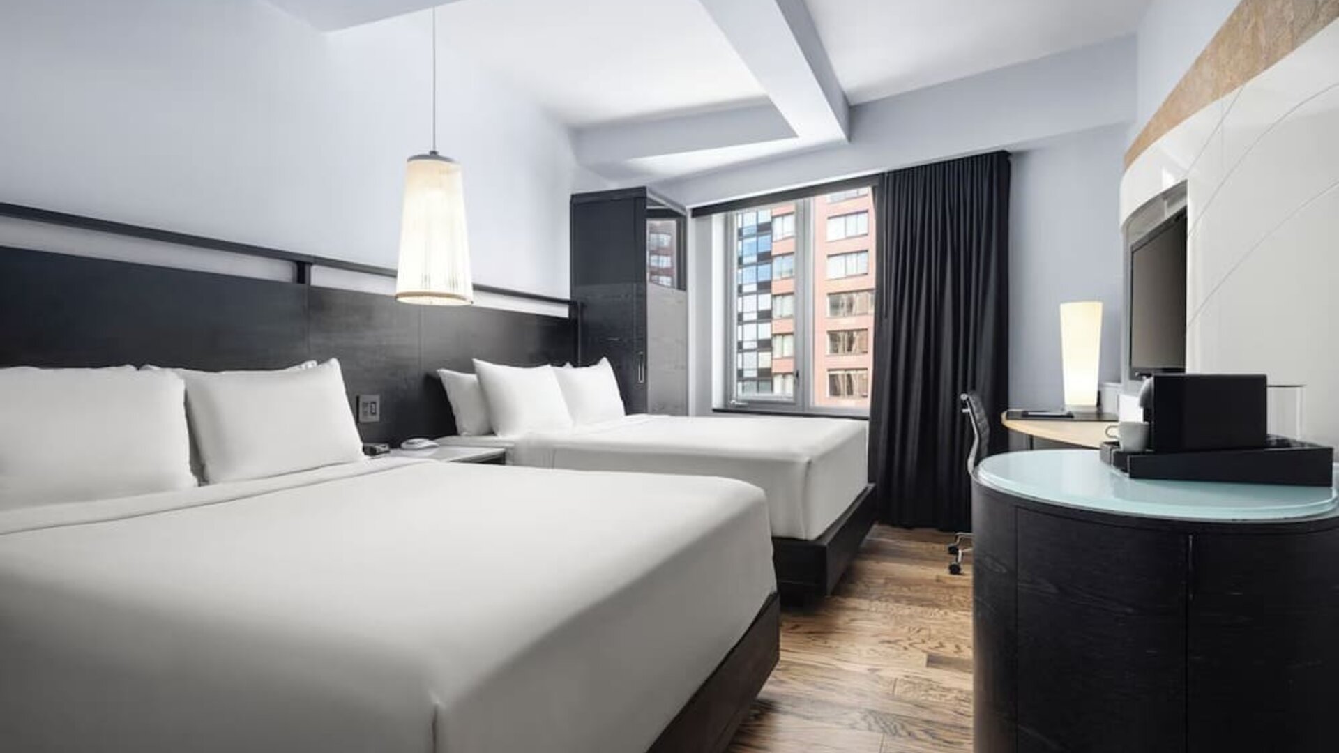 Double queen guest room with modern design and city views at Hyatt Union Square New York.