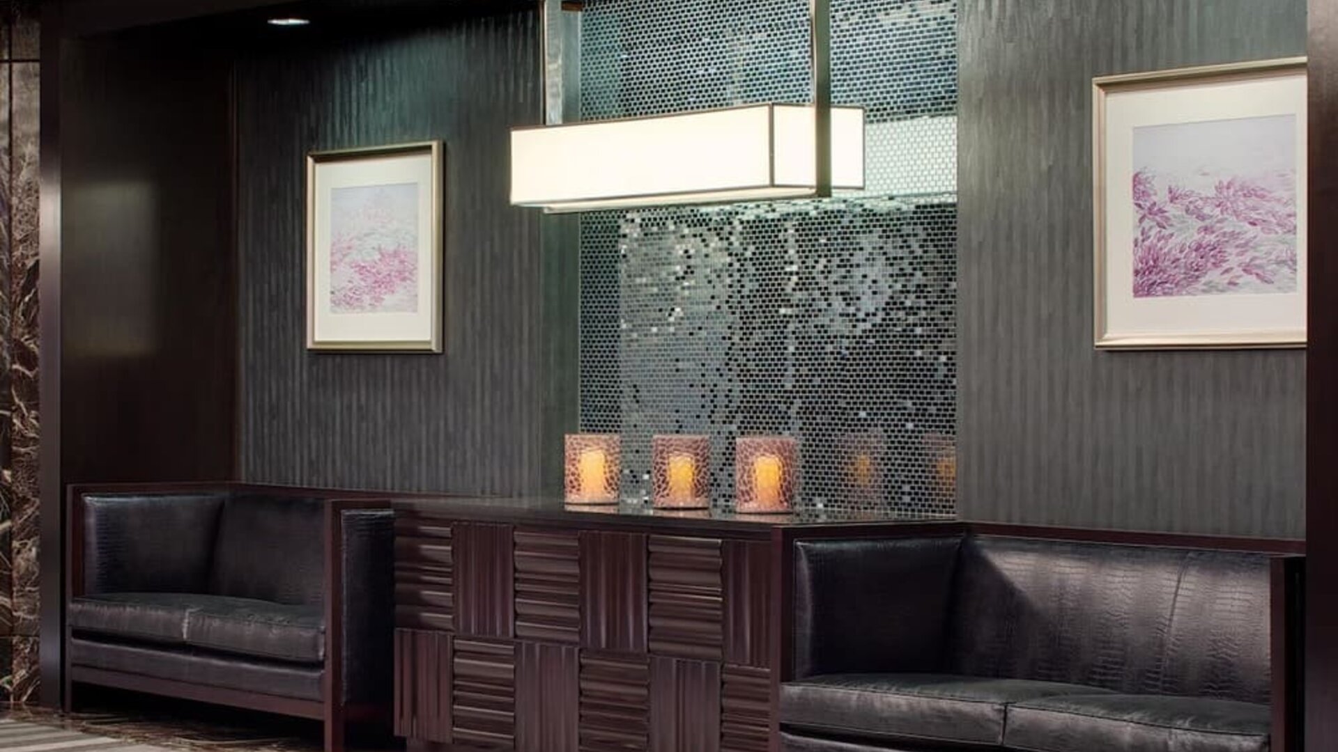 Sophisticated lobby seating area with dark wood accents and decorative lighting at Hyatt Regency Boston.
