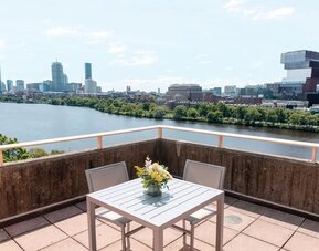 Rooftop-style terrace overlooking the Charles River and Boston skyline at Hyatt Regency Boston/Cambridge.