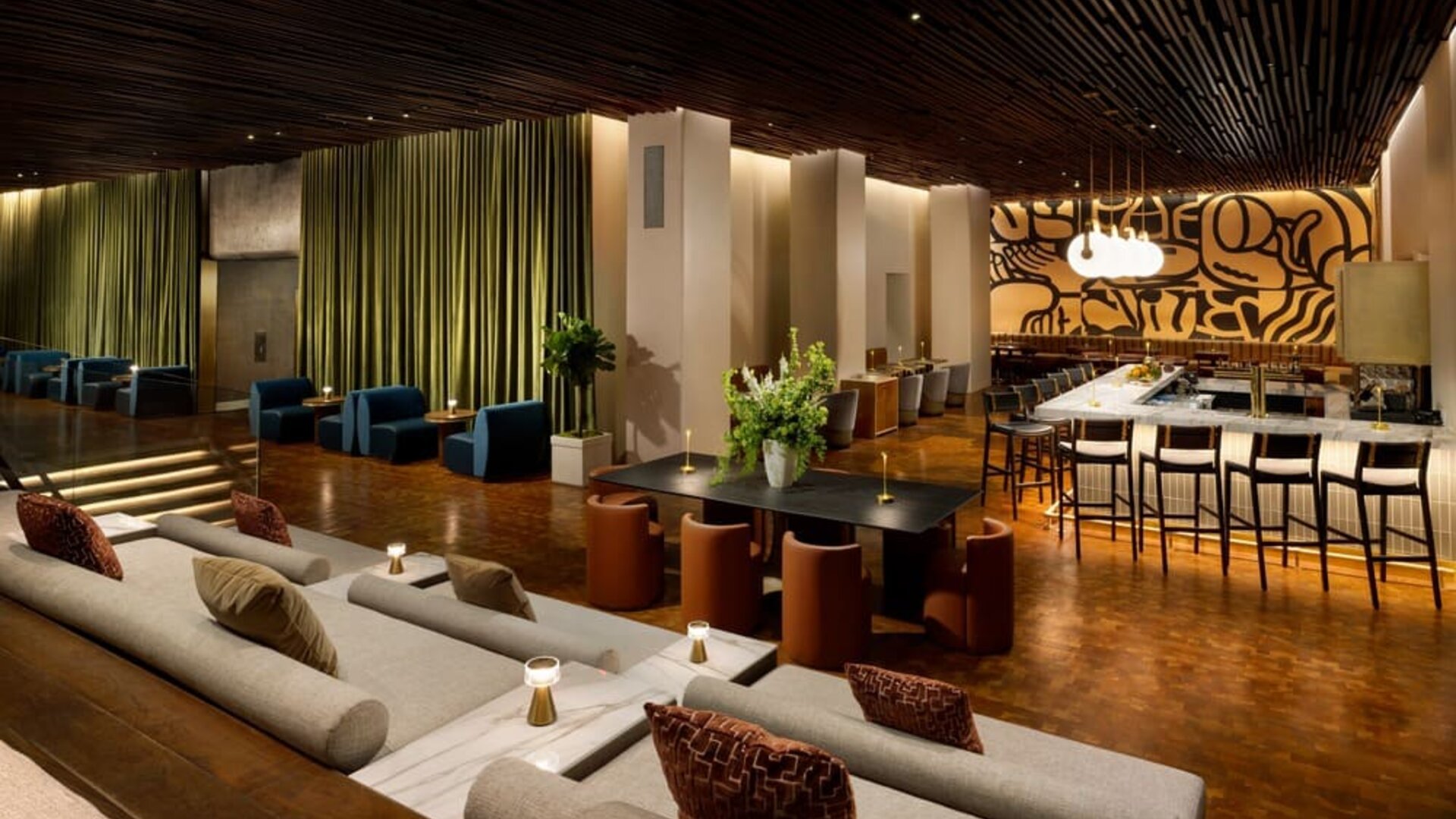 Spacious lobby seating area with upscale lounge furniture and stylish contemporary interiors at Row NYC.