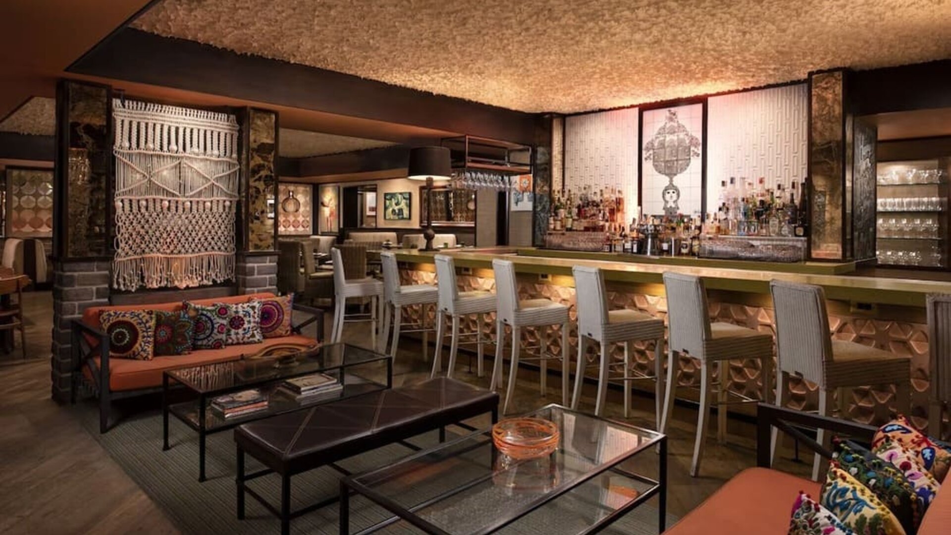 Sophisticated hotel bar featuring handcrafted décor, comfortable seating, and a full-service beverage area at The Garland.