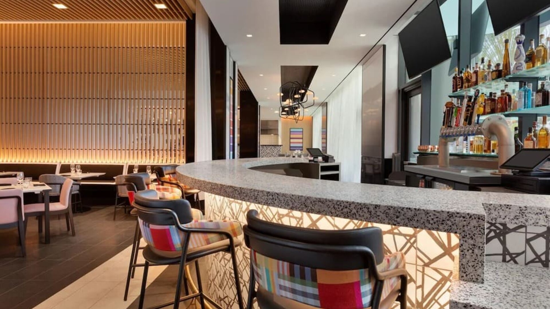 Stylish hotel bar and restaurant space offering contemporary décor, comfortable seating, and a vibrant setting for dining or evening drinks.