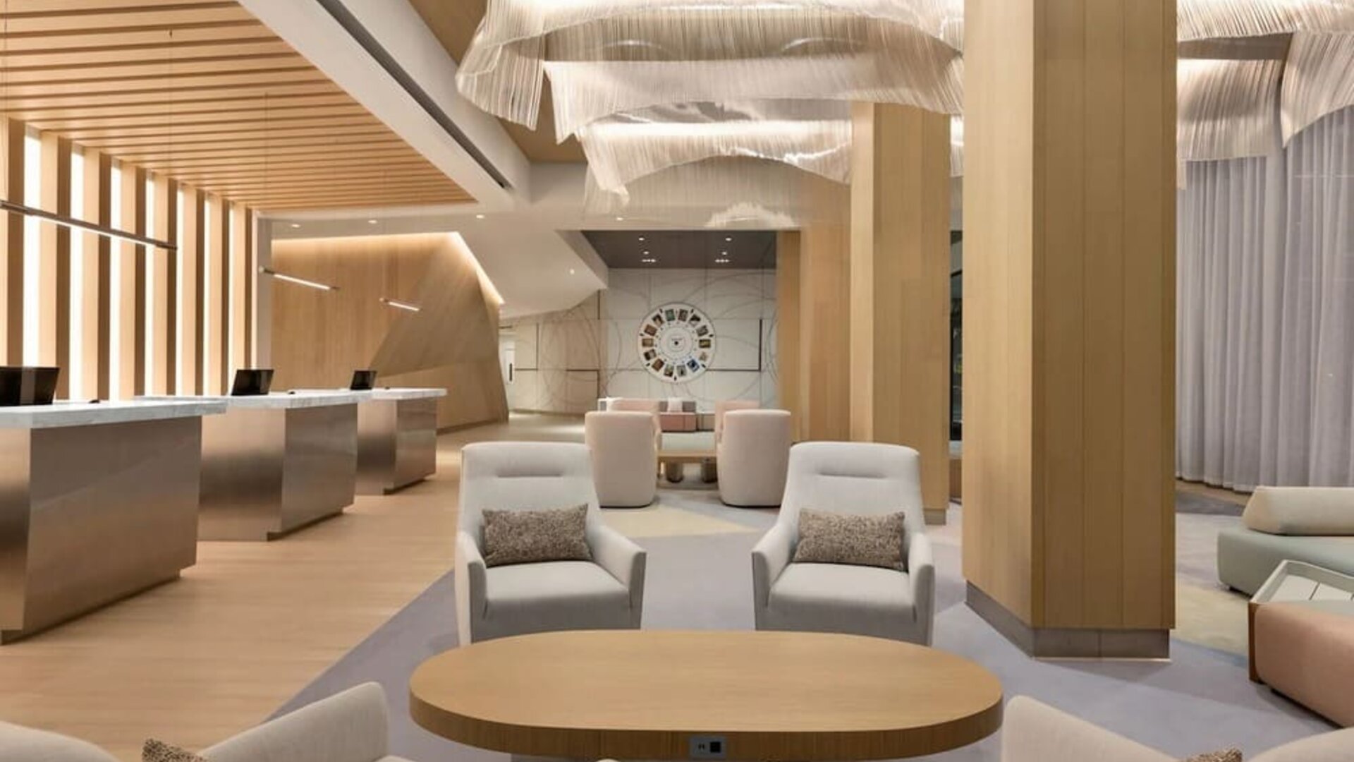 Sophisticated indoor lounge and reception area with contemporary furnishings, soft lighting, and open communal spaces.