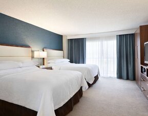 Twin bed available at Embassy Suites By Hilton Brea North Orange County.