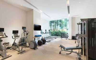 Fully equipped fitness center with treadmills and weights at the Hilton Garden Inn Singapore Serangoon.