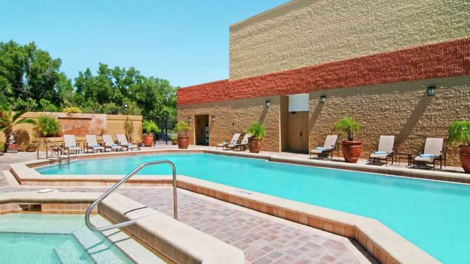 Relaxing outdoor pool area with at the Hilton Orlando-Altamonte Springs.