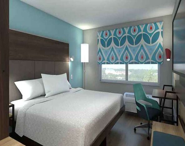 Delux king bed with work desk at Tru by Hilton Edinburg.