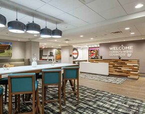 Spacious and comfortable lobby area perfect as workspace at the Hampton Inn Madison, OH.