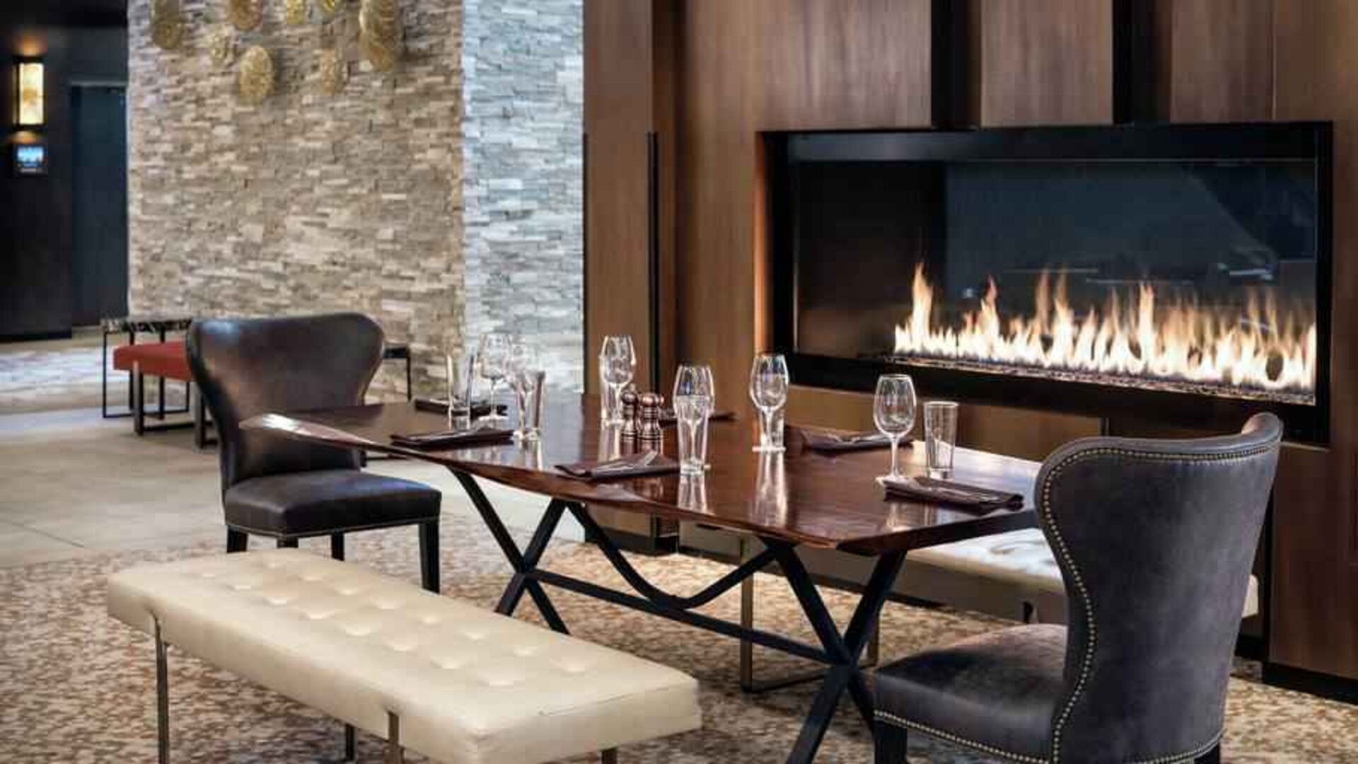 Elegant and comfortable fireside dining area perfect as workspace at the Hilton Denver City Center.