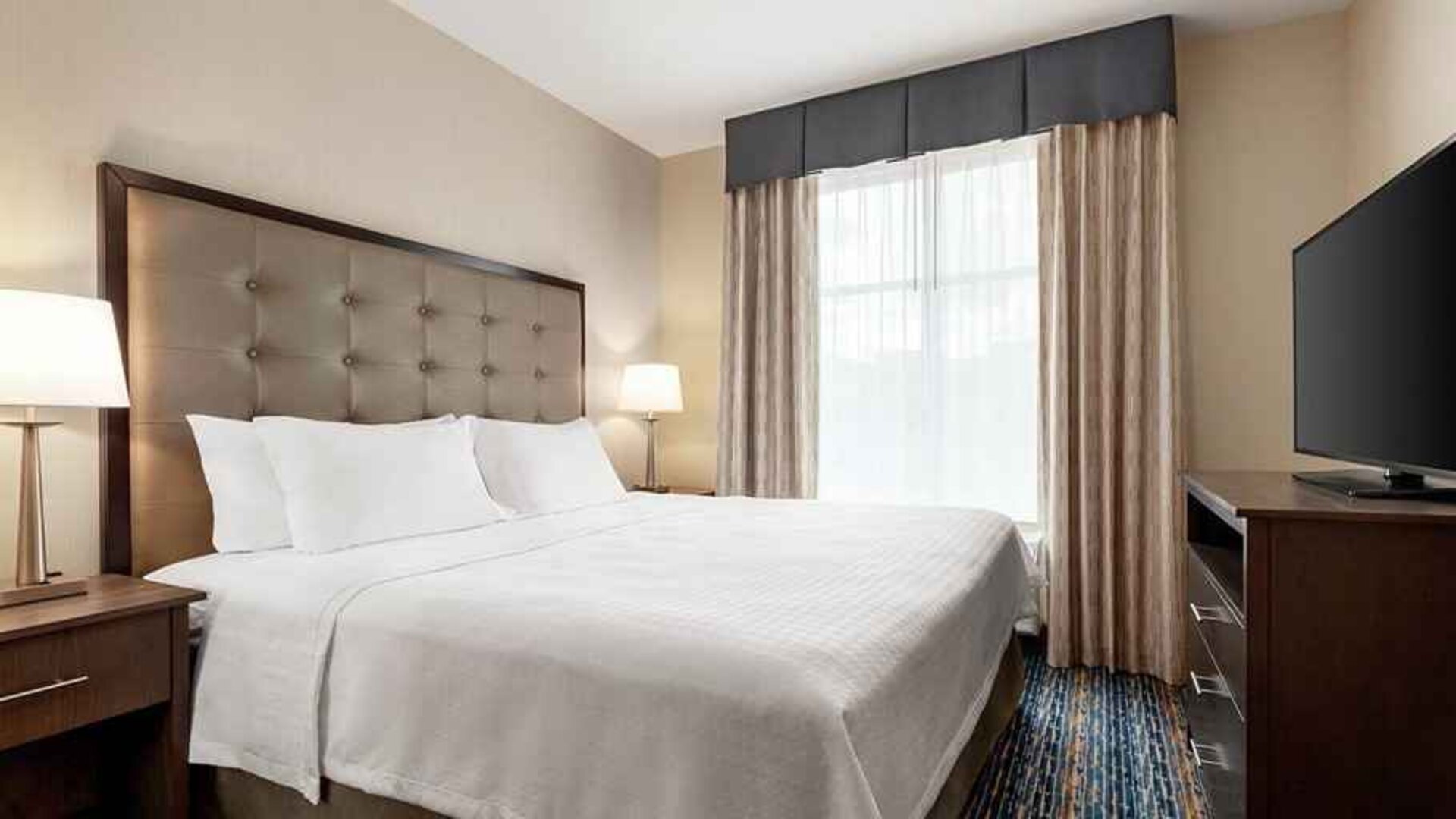 cosy king bedroom with natural light at Homewood Suites by Hilton Harlingen.