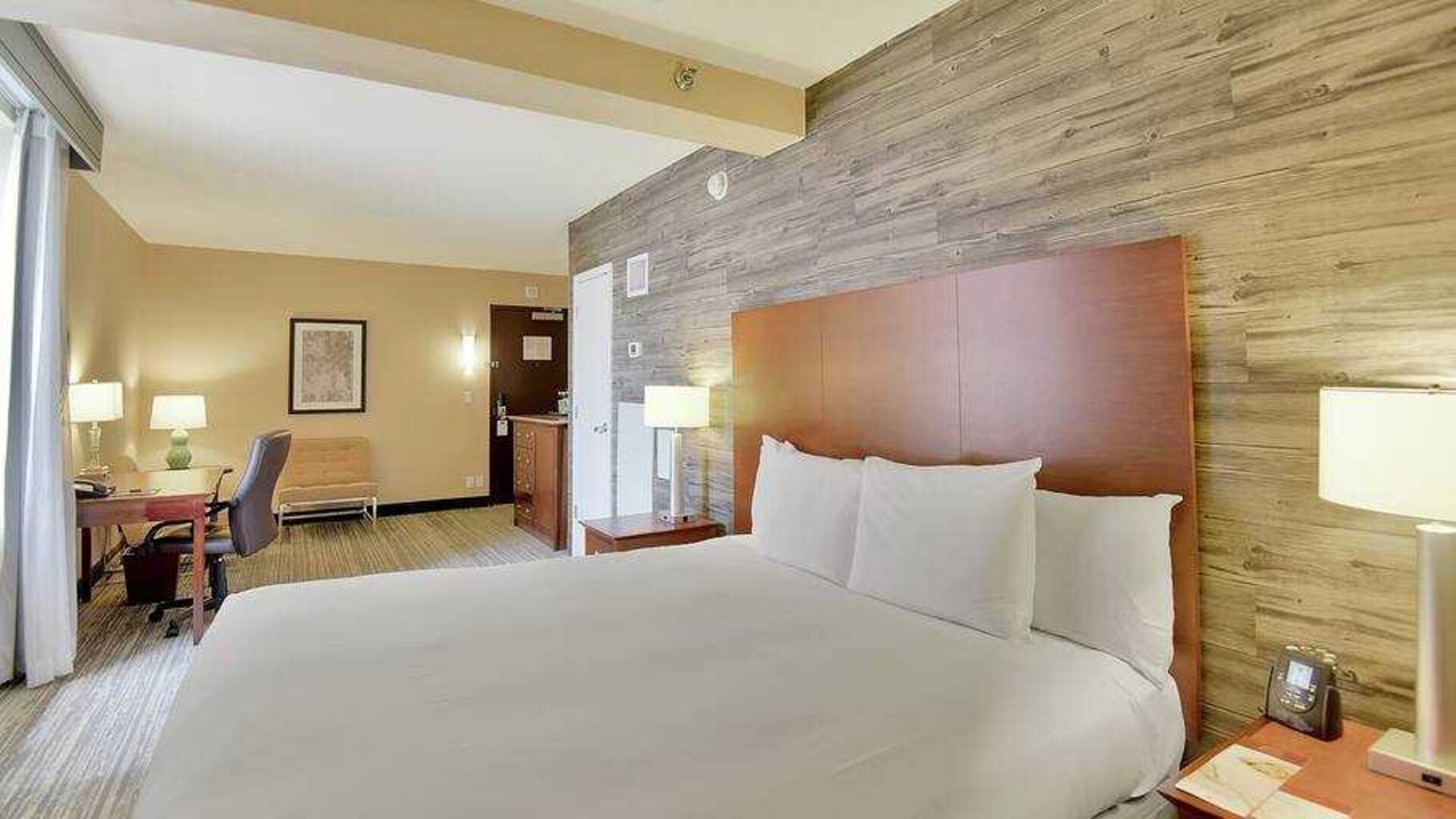 Stylish bedroom with king bed and working station at the DoubleTree Suites by Hilton Houston by the Galleria.