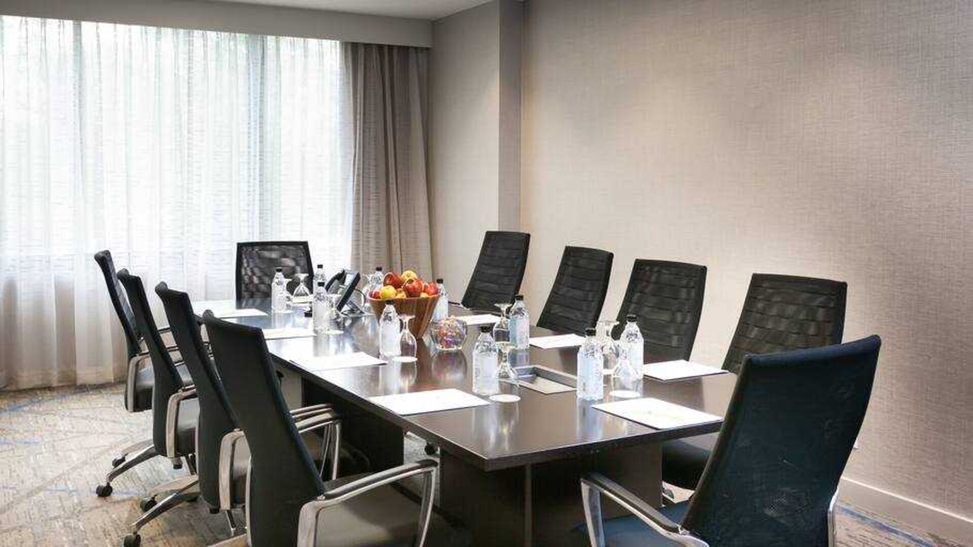 Meeting room with square conference table at the DoubleTree Suites by Hilton Houston by the Galleria.