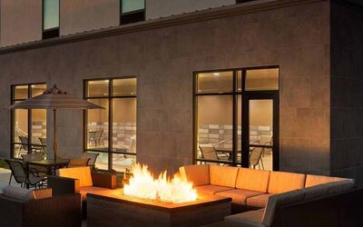 Beautiful outdoor patio with comfortable seating and coworking space at Hampton Inn By Hilton, Salt Lake City Cottonwood.
