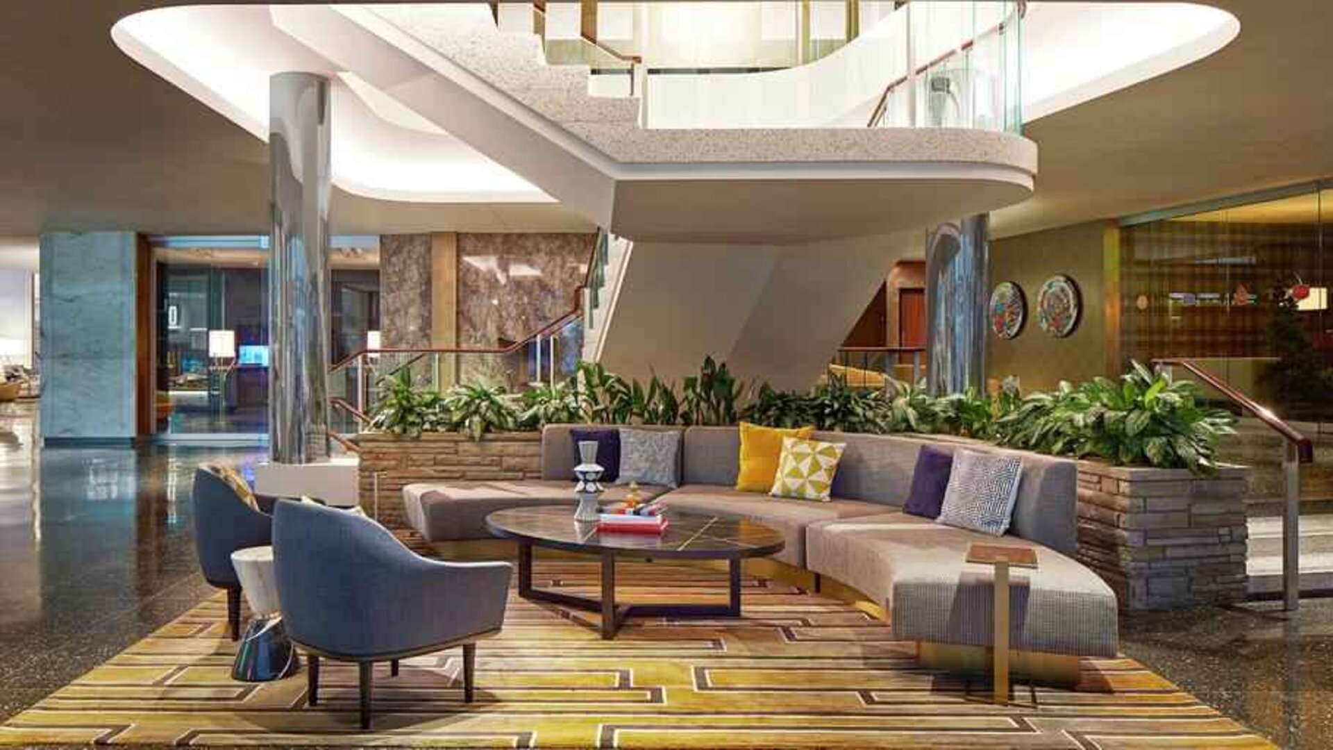 Elegant courtyard lobby perfect as workspace at the Statler Dallas, Curio Collection by Hilton.