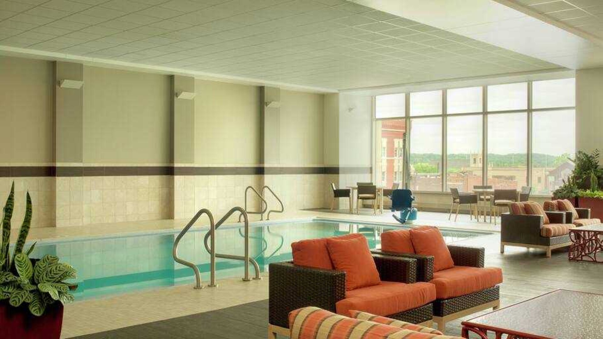 Relaxing indoor pool area at the DoubleTree by Hilton Cedar Rapids Convention Complex.