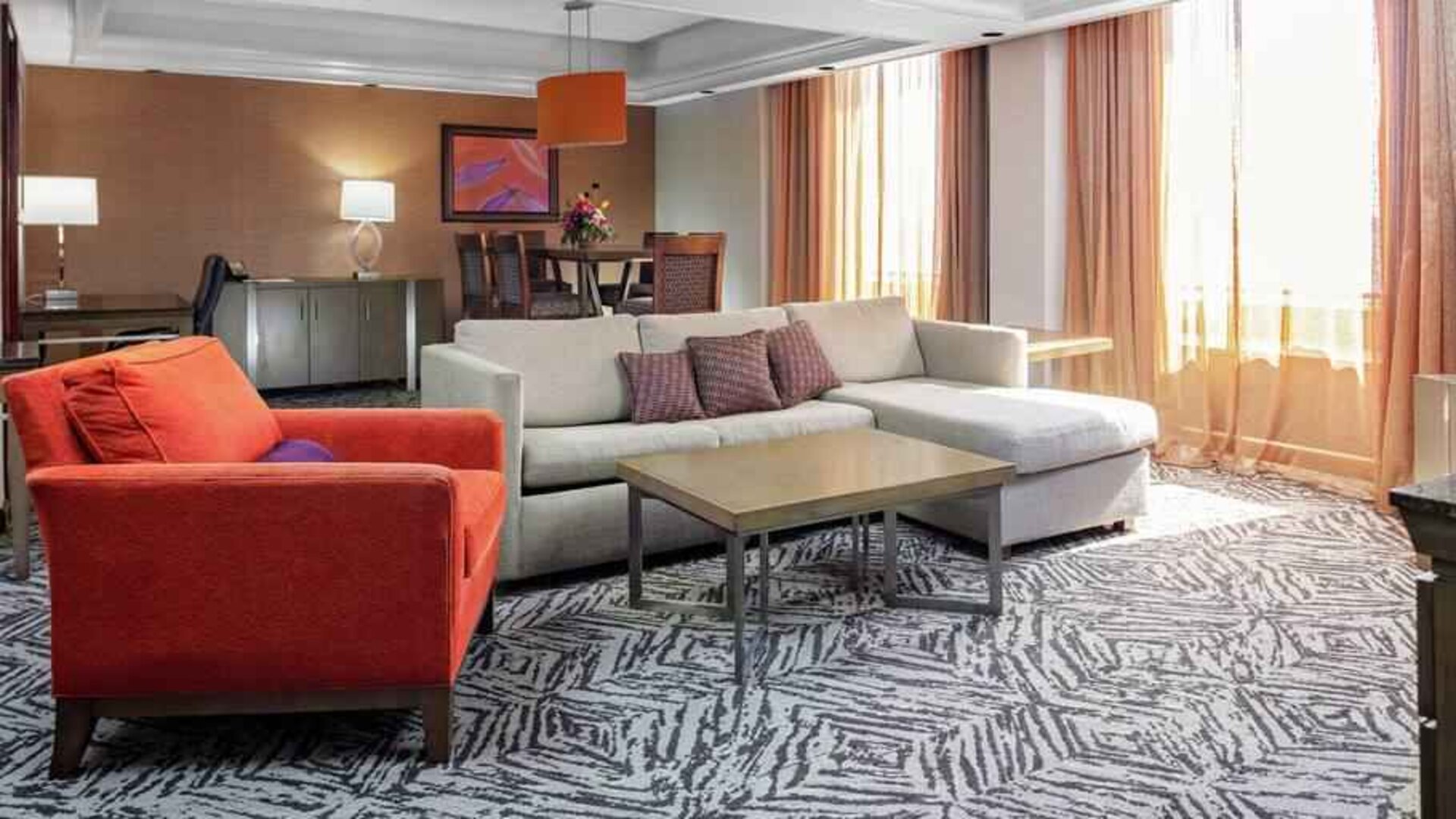 Spacious presidential suite with sofa and lounges at the DoubleTree by Hilton Omaha-Downtown.