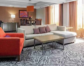 Spacious presidential suite with sofa and lounges at the DoubleTree by Hilton Omaha-Downtown.