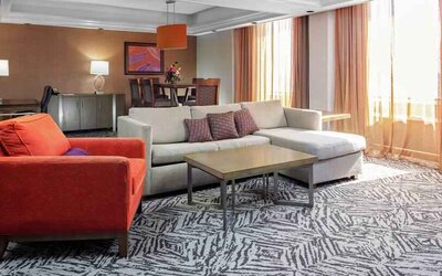 Spacious presidential suite with sofa and lounges at the DoubleTree by Hilton Omaha-Downtown.