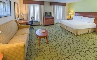 Spacious king suite with sofa and working station at the Hilton Garden Inn Tallahassee Central.