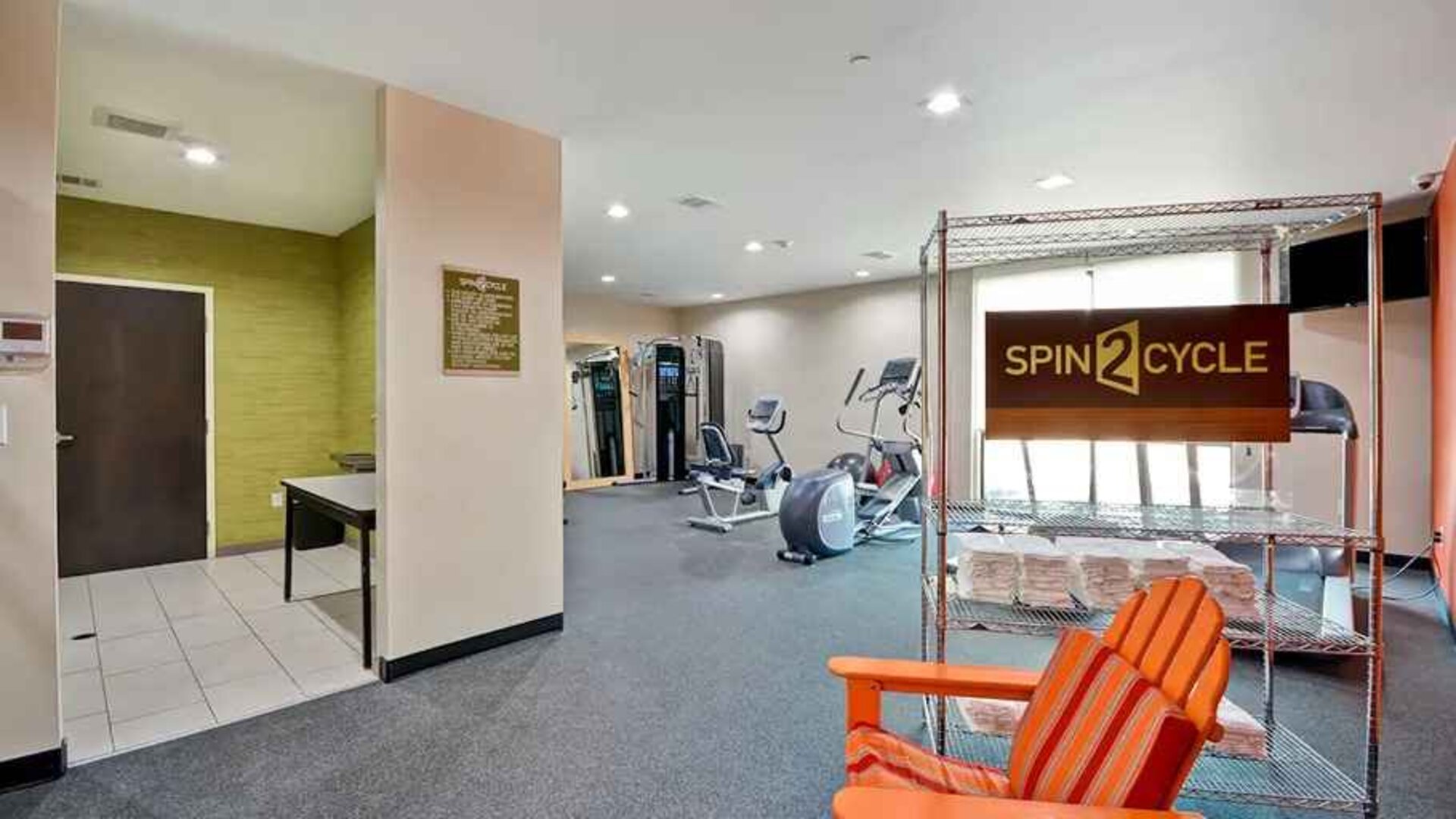 well-equipped fitness center and cycle studio at Home2 Suites by Hilton Fort Worth Southwest Cityview.