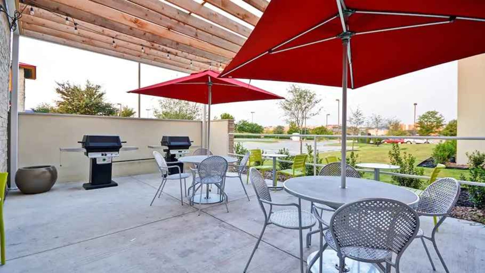 Relaxing outdoor patio for coworking and down time at Home2 Suites by Hilton Fort Worth Southwest Cityview.