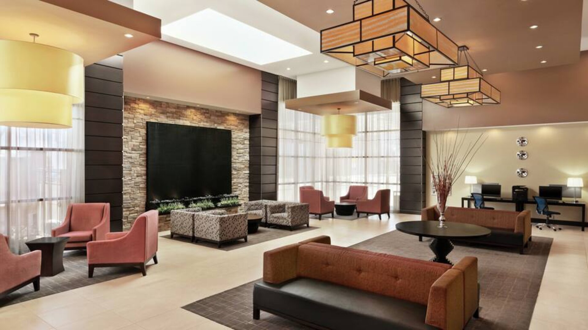 Elegant workspace in a hotel lobby at the Embassy Suites by Hilton Salt Lake City West Valley.