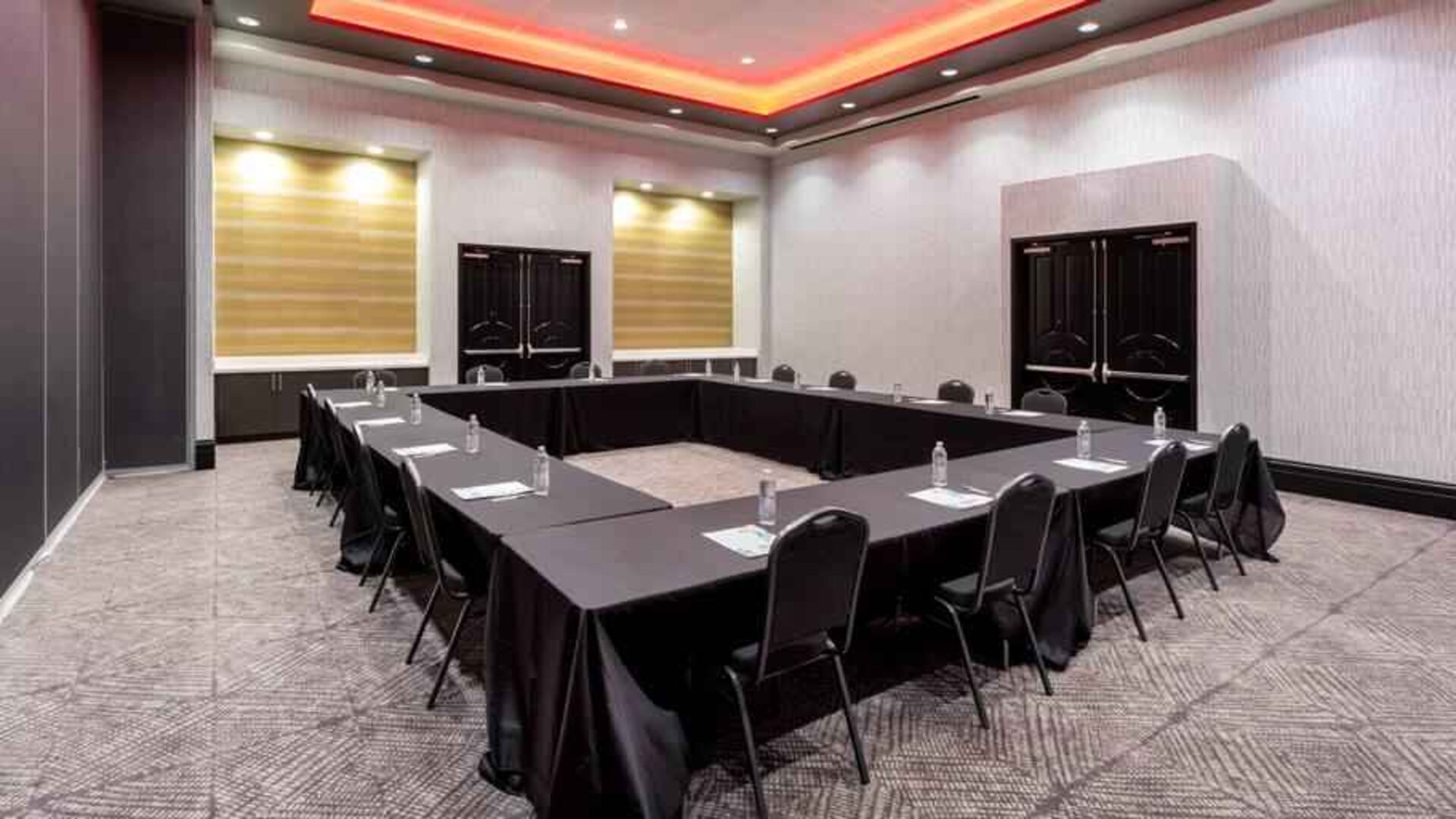 Meeting room with square table at the Hilton Garden Inn Hays.