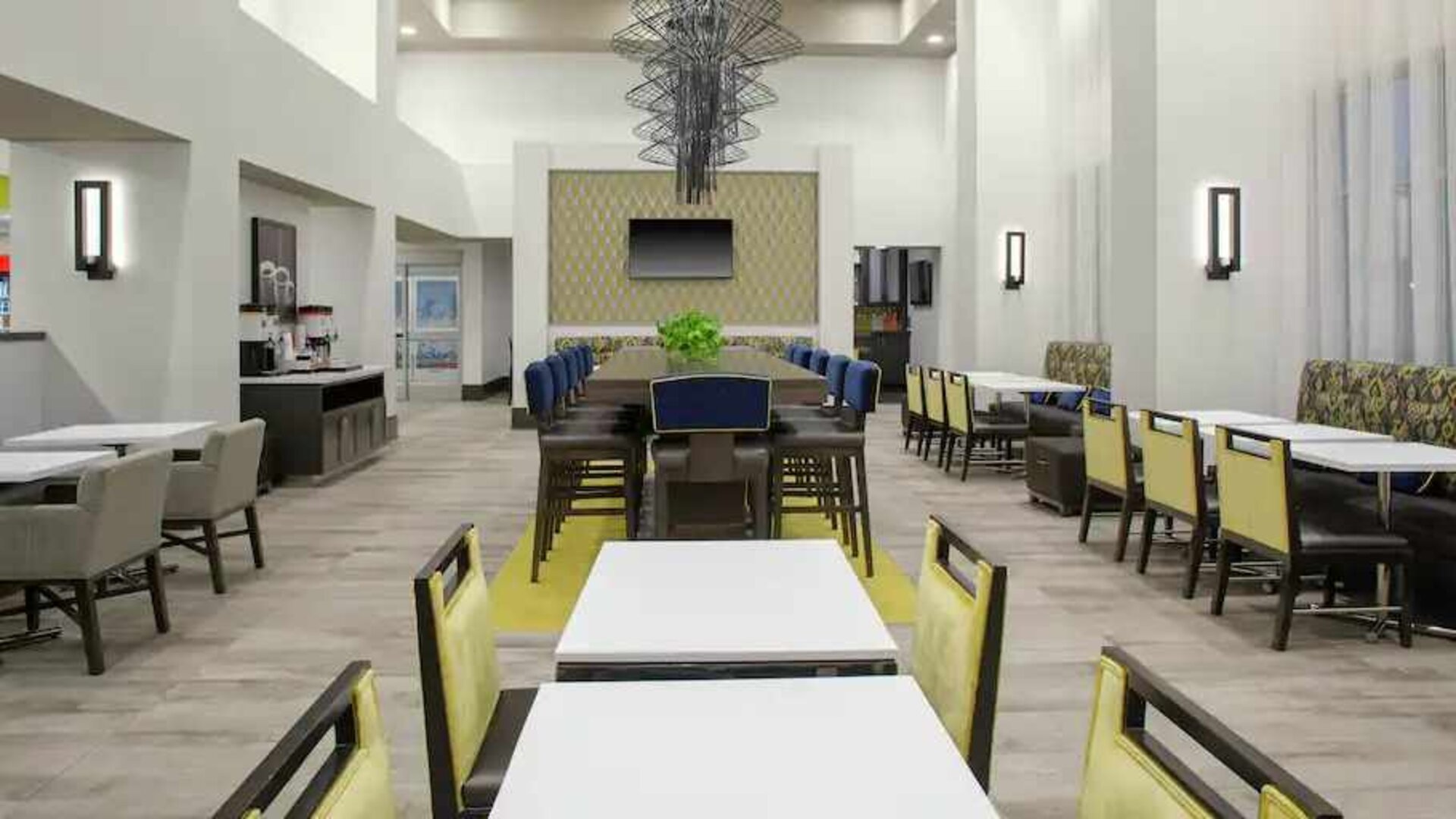 Comfortable dining area perfect as workspace at the Hampton Inn & Suites by Hilton-Irvine/Orange County Airport.