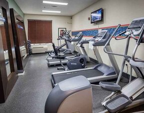 Well-equipped fitness center at Hampton Inn San Francisco Airport.