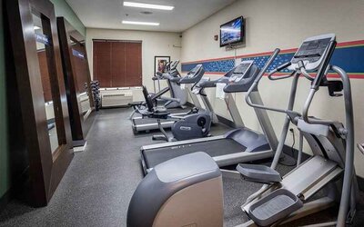 Well-equipped fitness center at Hampton Inn San Francisco Airport.