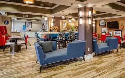 Colorful lobby and coworking space at Hampton Inn San Francisco Airport.