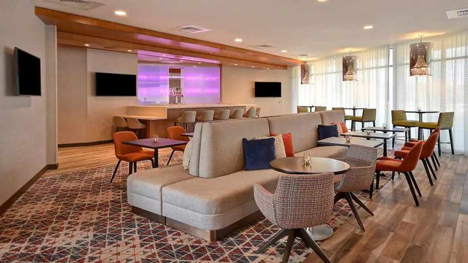 spacious indoor coworking area with natural light at Home2 Suites by Hilton Las Vegas Convention Center.