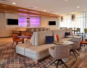 spacious indoor coworking area with natural light at Home2 Suites by Hilton Las Vegas Convention Center.