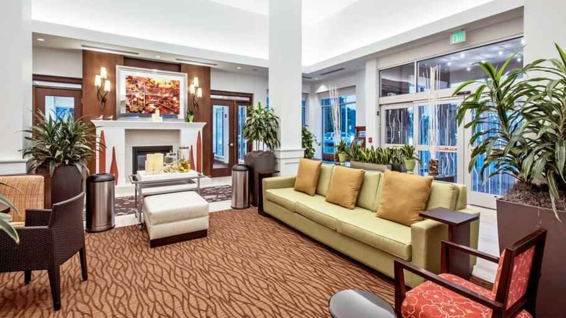 Workspace with lounges in a hotel lobby at the Hilton Garden Inn Minneapolis Airport Mall of America.