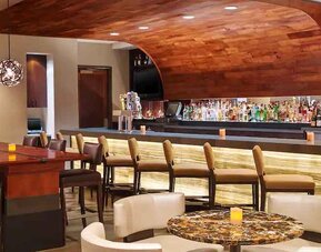 Stylish dining area perfect as workspace at the Hilton San Antonio-Airport.