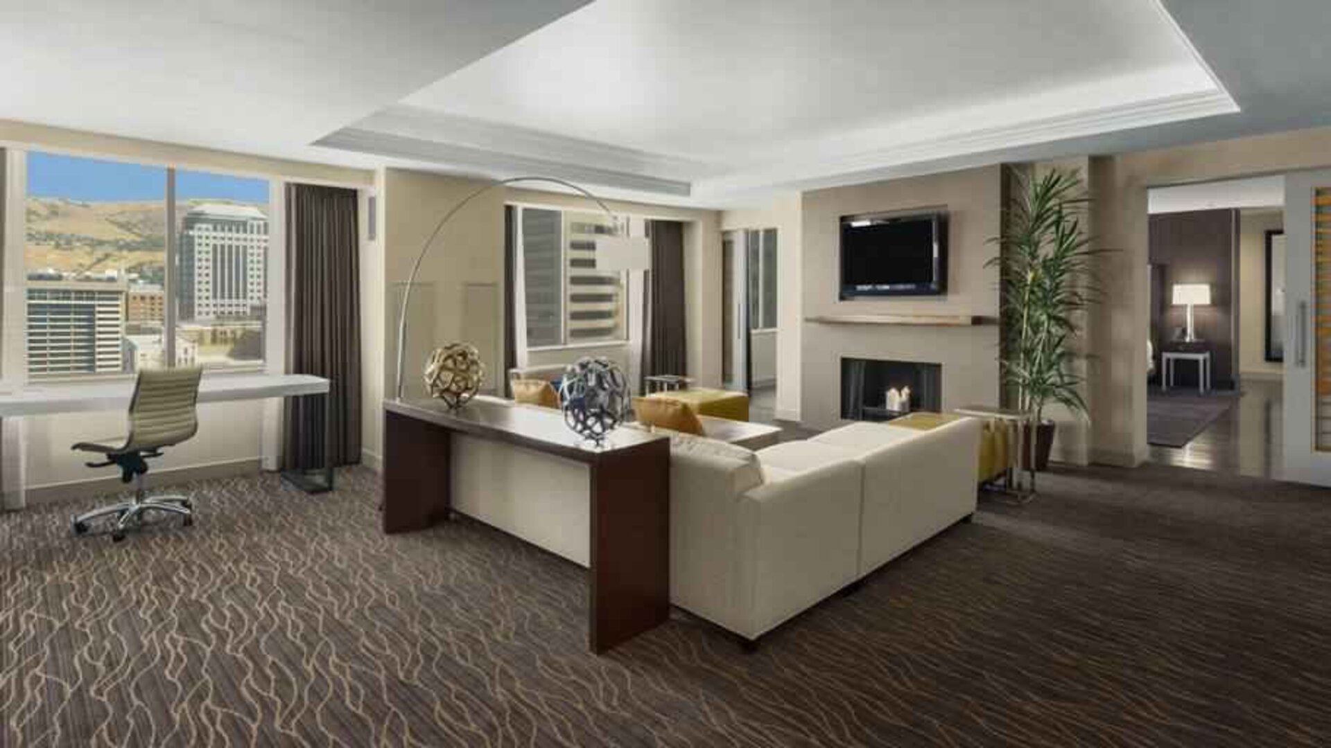 Beautiful living room with working station and seating area at the Hilton Salt Lake City Center.
