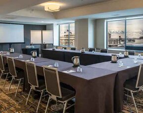 Meeting room with screen and windows at the Hilton Salt Lake City Center.