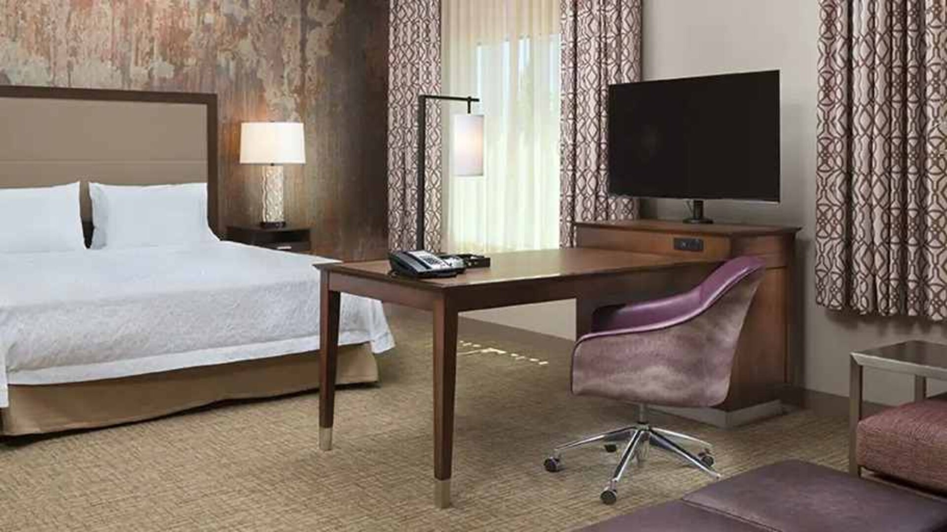 Spacious king suite with work area at Hampton Inn & Suites Murrieta Temecula.
