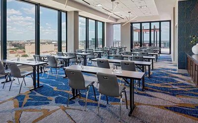 Professional conference room with a lot of natural light and city views at Hilton Garden Inn Austin University.