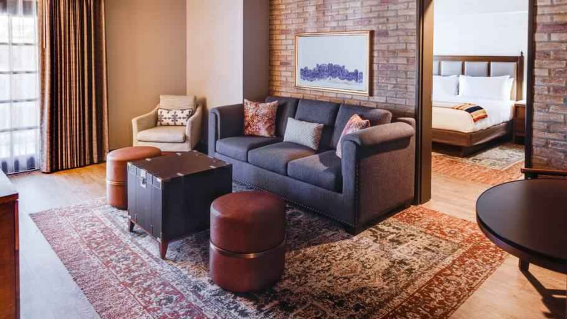 Stylish living room in a king suite at the Estancia del Norte San Antonio, Tapestry Collection.