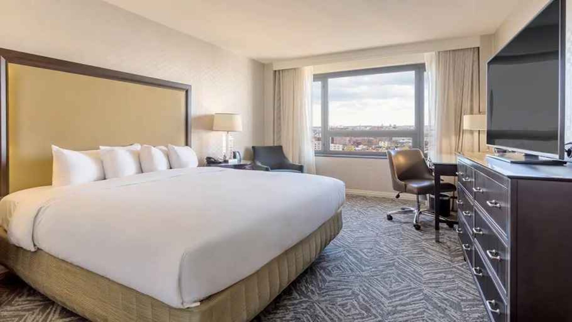 spacious king room with work area and natural light at Washington Hilton.