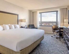 spacious king room with work area and natural light at Washington Hilton.