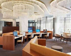 spacious and well-lit coworking space and business center ideal for remote working at Washington Hilton.