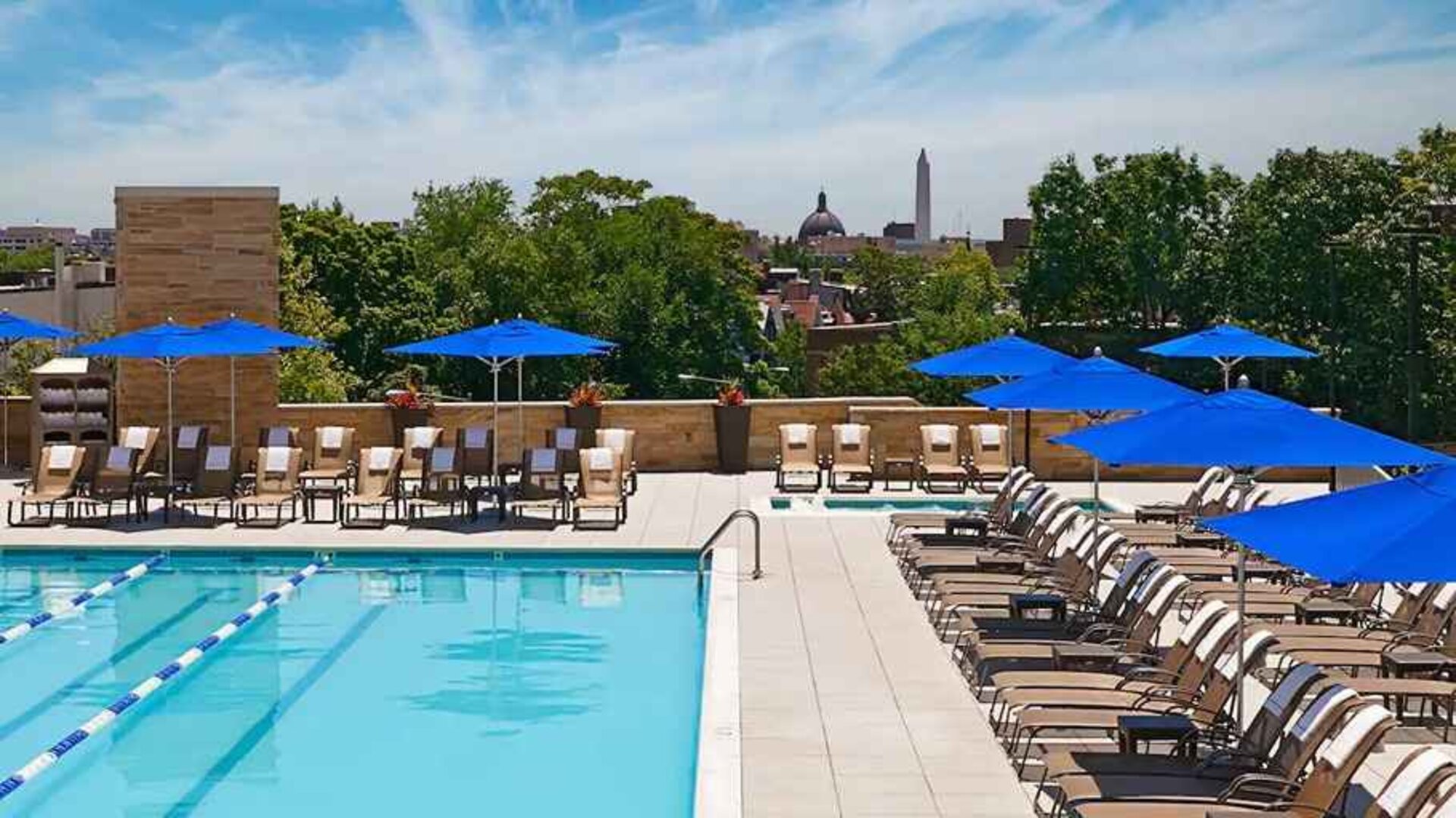 gorgeous outdoor pool with seating and sun beds at Washington Hilton.