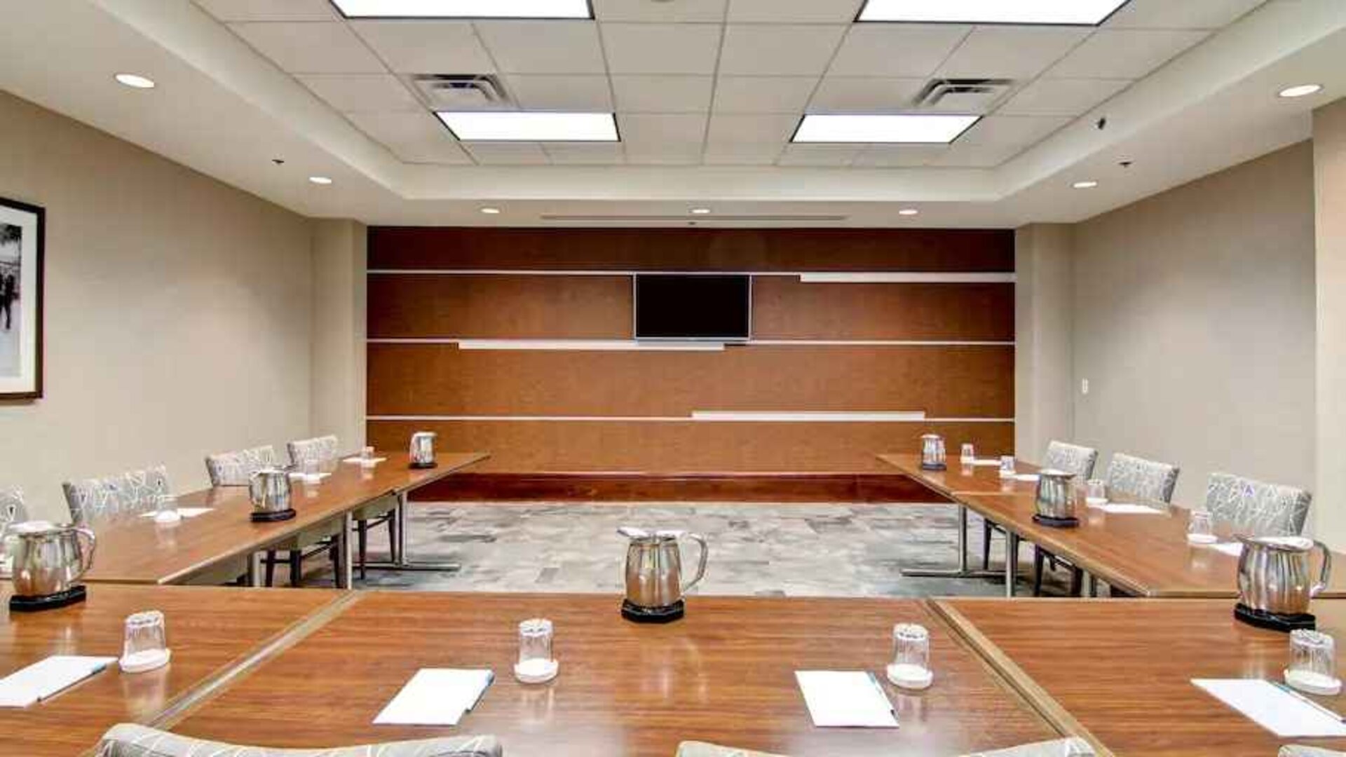 Elegant meeting room with screen at the Homewood Suites by Hilton Washington, D.C. Downtown.