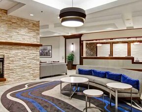 Workplace by the fireplace in a hotel lobby at the Homewood Suites by Hilton Washington, D.C. Downtown.