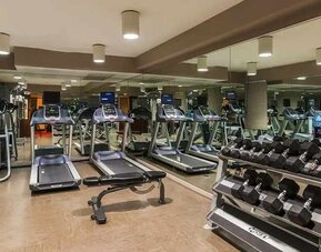 Well-equipped fitness center at The Sam Houston, Curio Collection by Hilton.
