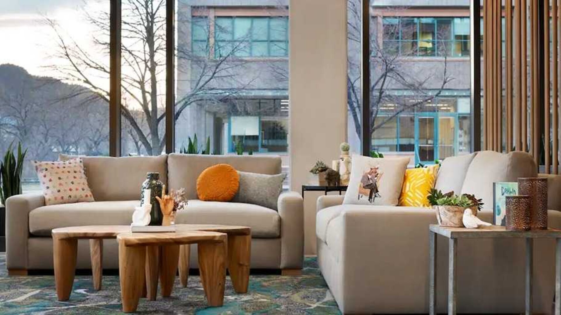 comfortable lobby lounge area with natural light ideal for coworking at Embassy Suites by Hilton Boulder.