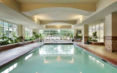 Relaxing indoor swimming pool at the Embassy Suites by Hilton Charleston Airport Convention Center.